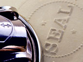 Closeup of seal stamped into paper with stamper